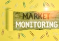 Word writing text Market Monitoring. Business concept for supervising activities in progress in the trading center Paper clip and