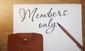 Word writing text Members Only on Open notebook page, leather wallet and a pen on wooden table. Business concept for Limited to an Royalty Free Stock Photo