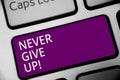 Word writing text Never Give Up. Business concept for Keep trying until you succeed follow your dreams goals Keyboard purple key I