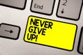 Word writing text Never Give Up. Business concept for Keep trying until you succeed follow your dreams goals Keyboard yellow key I