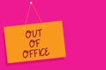 Word writing text Out Of Office. Business concept for Outside the job Nobody in business Break Leisure Relax time Orange board wal Royalty Free Stock Photo