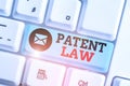 Word writing text Patent Law. Business concept for deals with an inventor s is exclusive right to use own invention.