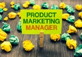 Word writing text Product Marketing Manager. Business concept for who responsible for putting plan to sell product Clothespin hold Royalty Free Stock Photo