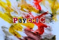 Word writing text Psychic from cut letters on abstract strokes bright colorful background. Headline , card of psychology .