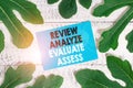 Word writing text Review Analyze Evaluate Assess. Business concept for Evaluation of perforanalysisce feedback process.