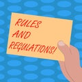 Word writing text Rules And Regulations. Business concept for guidelines to follow when entering into a transaction