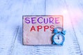 Word writing text Secure Apps. Business concept for protect the device and its data from unauthorized access Mini blue alarm clock