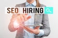 Word writing text Seo Hiring. Business concept for employing a specialist will develop content to include keywords