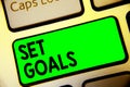 Word writing text Set Goals. Business concept for Defining or achieving something in the future based on plan Keyboard green key I Royalty Free Stock Photo