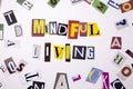 A word writing text showing concept of MINDFUL LIVING made of different magazine newspaper letter for Business case on the white b Royalty Free Stock Photo