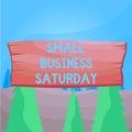 Word writing text Small Business Saturday. Business concept for American shopping holiday held during the Saturday Plank