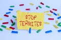 Word writing text Stop Termites. Business concept for prevent a small tropical insect from damaging the woods Colored clothespin Royalty Free Stock Photo