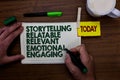 Word writing text Storytelling Relatable Relevant Emotional Engaging. Business concept for Share memories Tales Man holding marker