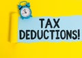 Word writing text Tax Deductions. Business concept for reduction income that is able to be taxed of expenses.