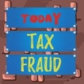 Word writing text Tax Fraud. Business concept for entails cheating on a tax return in an attempt to avoid paying Wooden