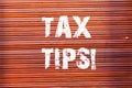 Word writing text Tax Tips. Business concept for compulsory contribution to state revenue levied by government Brick