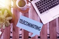 Word writing text Telecommuting. Business concept for work at home using an electronic linkup with central office Paper