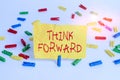 Word writing text Think Forward. Business concept for The act of thinking about and planning for the future Colored clothespin Royalty Free Stock Photo