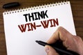 Word writing text Think Win-Win. Business concept for Negotiation strategy for both partners to obtain benefits written by Man on Royalty Free Stock Photo