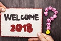 Word writing text Welcome 2018. Business concept for Celebration New Celebrate Future Wishes Gratifying Wish written on Cardboard