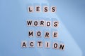 Word writing text LESS WORDS MORE ACTION. Business concept written on wood block. Royalty Free Stock Photo