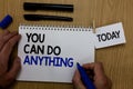 Word writing text You Can Do Anything. Business concept for Motivation for doing something Believe in yourself Hand hold pen notep