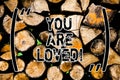 Word writing text You Are Loved. Business concept for Somebody loves you have strong feelings happy excited Wooden