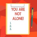 Word writing text You Are Not Alone. Business concept for Offering help support assistance collaboration company Blank Royalty Free Stock Photo