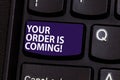 Word writing text Your Order Is Coming. Business concept for Product on the way shipping of purchase products Keyboard Royalty Free Stock Photo