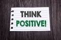 Word, writing Think Positive. Business concept for Positivity Attitude written on sticky note paper on the dark wooden background. Royalty Free Stock Photo