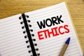 Word, writing Work Ethics. Business concept for Moral Benefit Principles written on notepad with copy space on old wood wooden bac