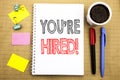 Word, writing You Are Hired. Business concept for Hiring Employee Worker Written on notepad note paper background with space offic Royalty Free Stock Photo