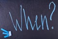 Word When written with blue chalk on black board. Royalty Free Stock Photo