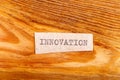 The word "innovation" typed. The inscription on a gray sheet of pappier