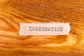 The word "inspiration" typed. The inscription on a gray sheet of pappier