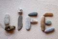 Word "Life" written using colored stones on white sand Royalty Free Stock Photo