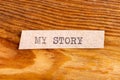 The word "my story" typed. The inscription on a gray sheet of pappier