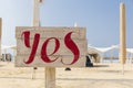 Word yes on the information board on the beach Royalty Free Stock Photo