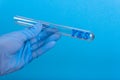 Word yes in test-tube holding a gloved hand Royalty Free Stock Photo