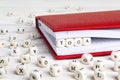 Word Yoga written in wooden blocks in red notebook on white wood Royalty Free Stock Photo