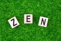 Word Zen written in wooden letters laid on grass