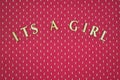 Wording of it`s a girl on a pink background