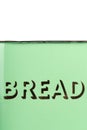 Wording on the side of a vintage 1930s green enamel bread bin