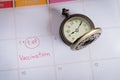 Wording Vaccinaton on calendar with vintage pocket watch ,appiontment. Royalty Free Stock Photo