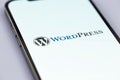 WordPress logo mobile app on a screen smartphone iPhone macro. WordPress - open source site content management system