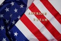 The words American dream laid with wooden letters on the USA flag background. American Dream Concept Royalty Free Stock Photo