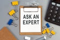 The words ask an expert written on a white notebook Royalty Free Stock Photo