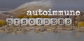 Words AUTOIMMUNE DISORDERS composed of wooden dices
