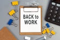 The words Back to work written on a white notebook. Work and study concept Royalty Free Stock Photo