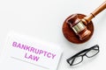 Words bankruptcy law written on the documents near judge gavel on white background top view space for text Royalty Free Stock Photo